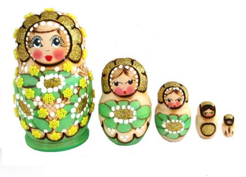 Poupées russes vertes avec des fleurs artisanat russe